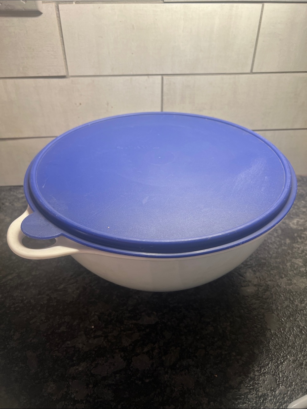That’s a Bowl Tupperware Mixing Bowl with Blue Lid - White Bowl. 32 cup.